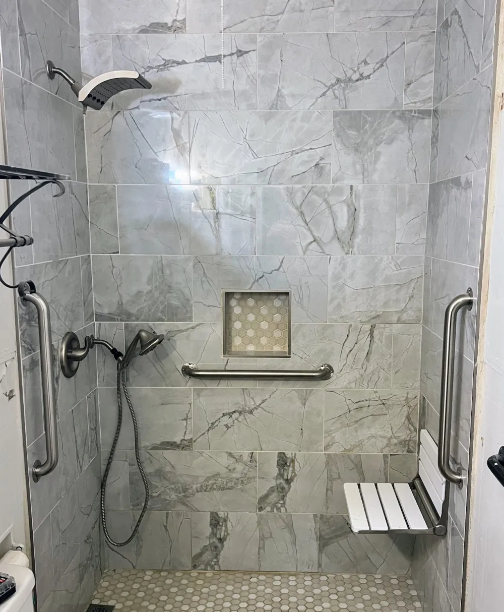 Tiled roll-in shower with safety rails