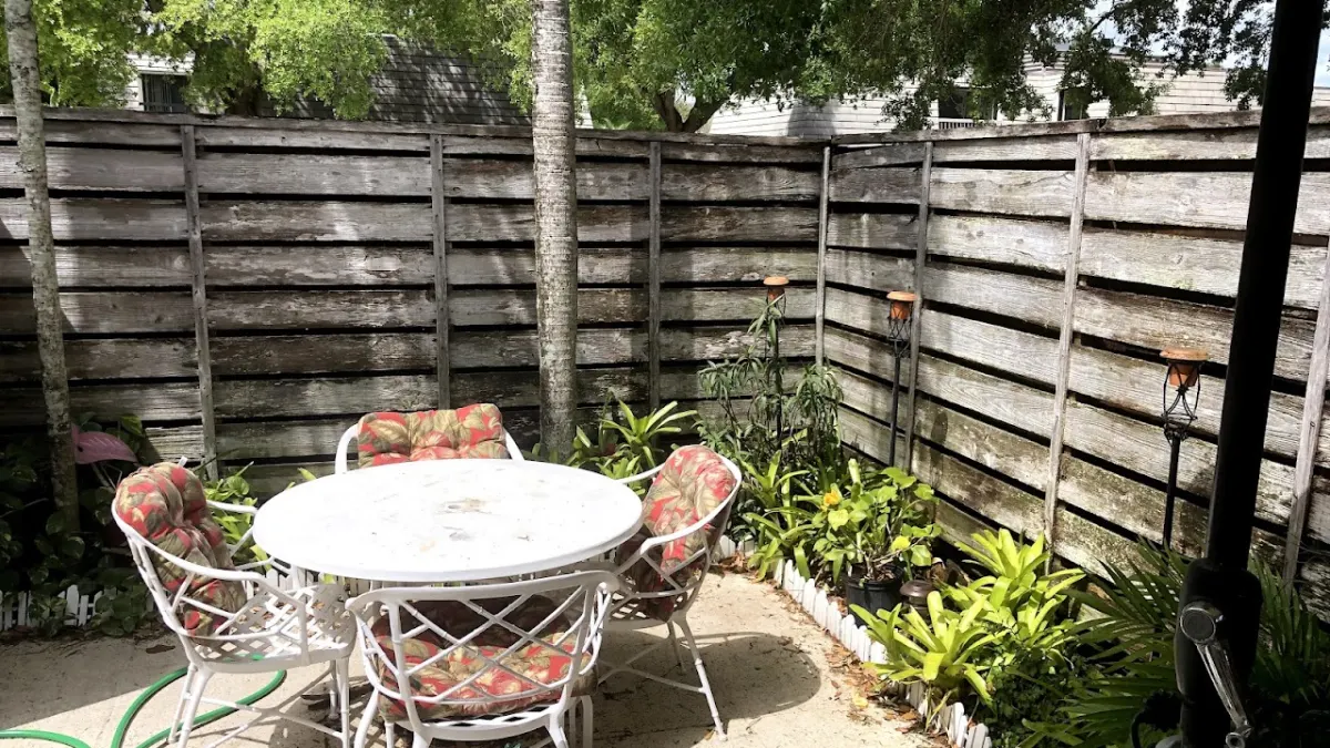 Old weathered leaning fence before