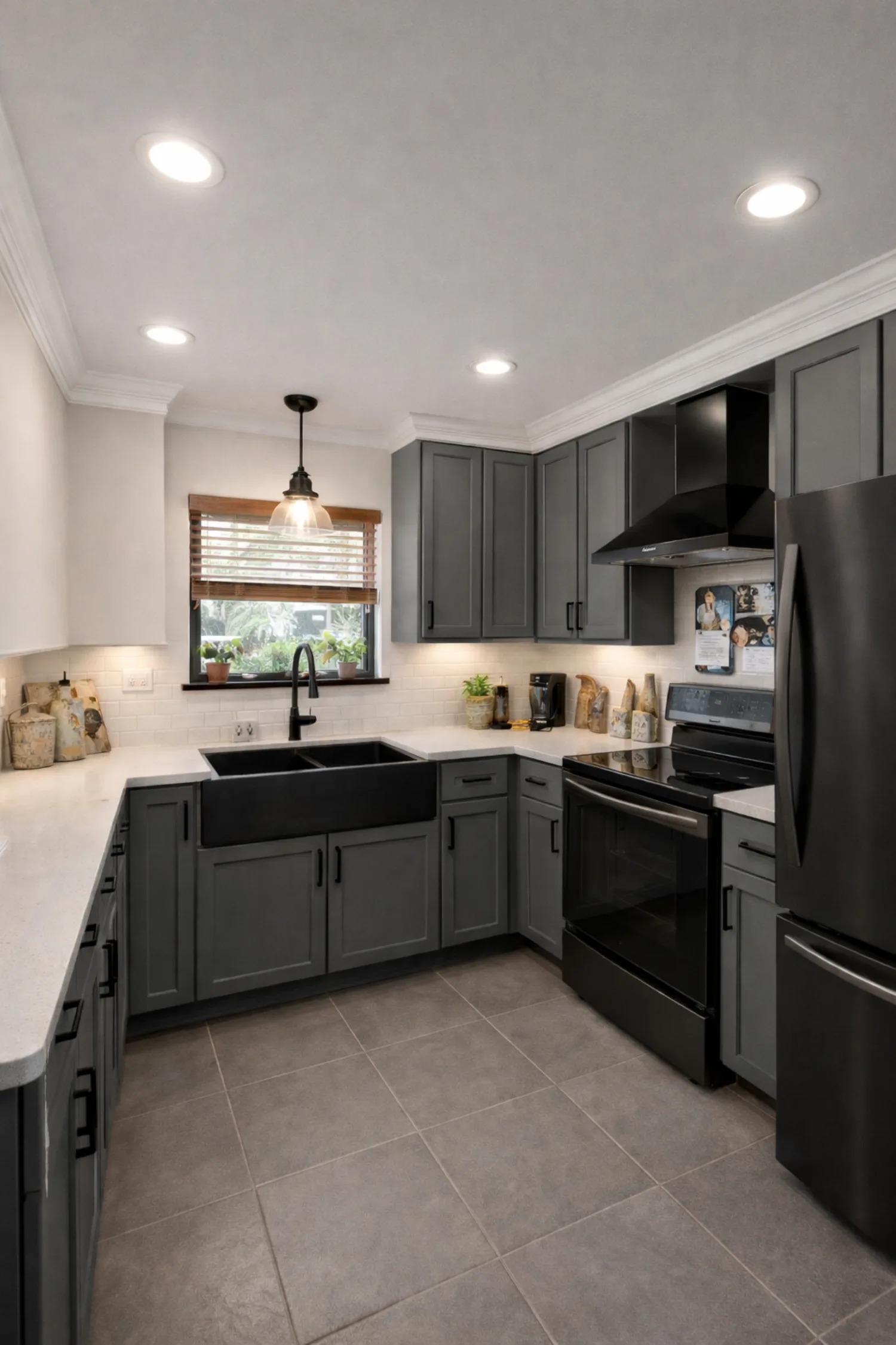Modern gray shaker kitchen remodel with quartz counters and matte black fixtures